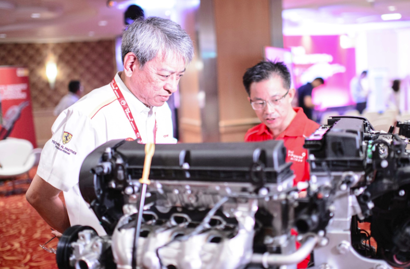 Samuel de Guzman, General Manager of Retail Sales and Operations for Shell Singapore along with Colin Chin, Shell Fuels Scientist inspect the Split Engine at the launch event of Shell V-Power Nitro+.