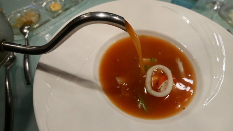 Clear seafood broth, which was light on the palate. 