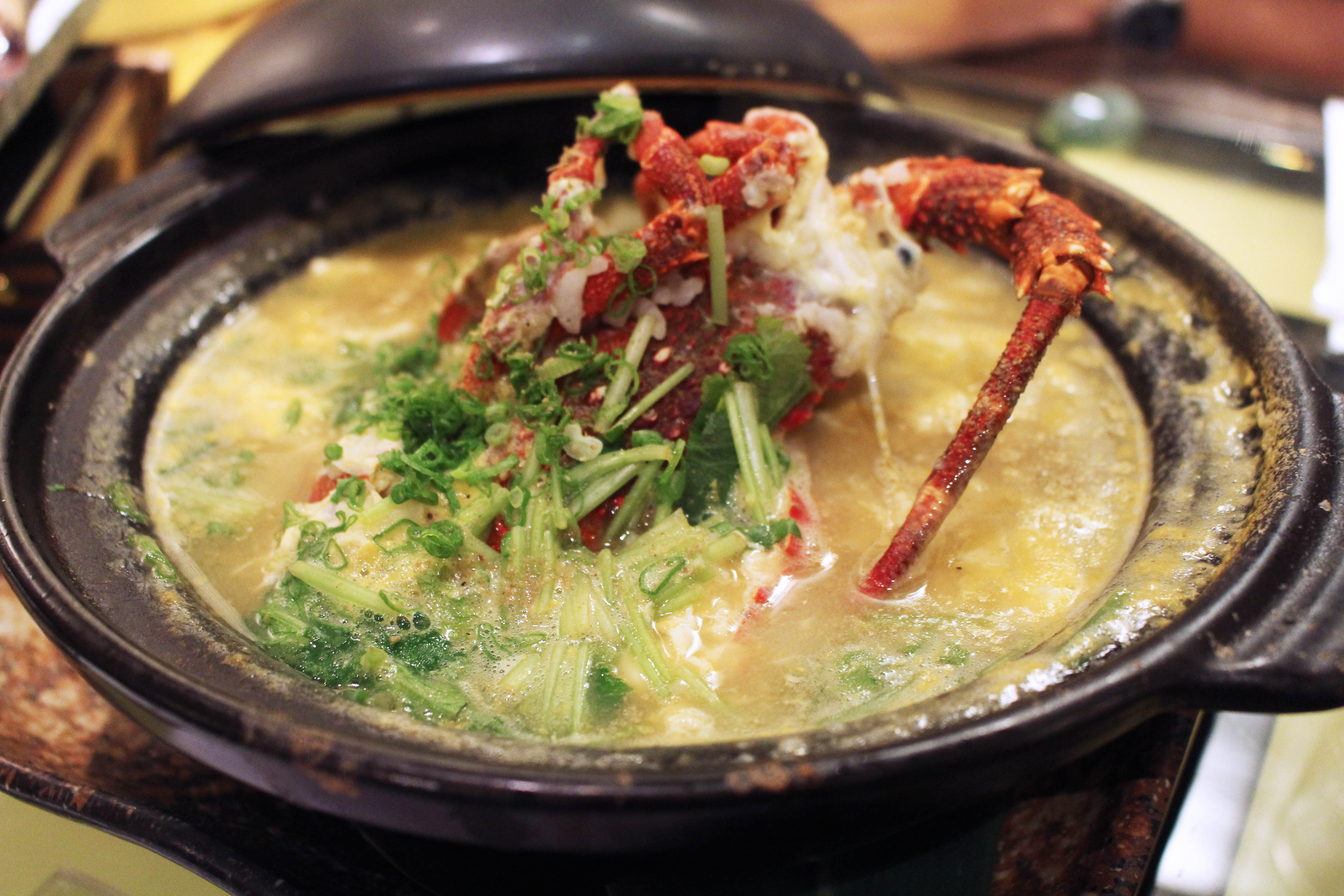 Whole boiled rock lobster in claypot porridge, $24.