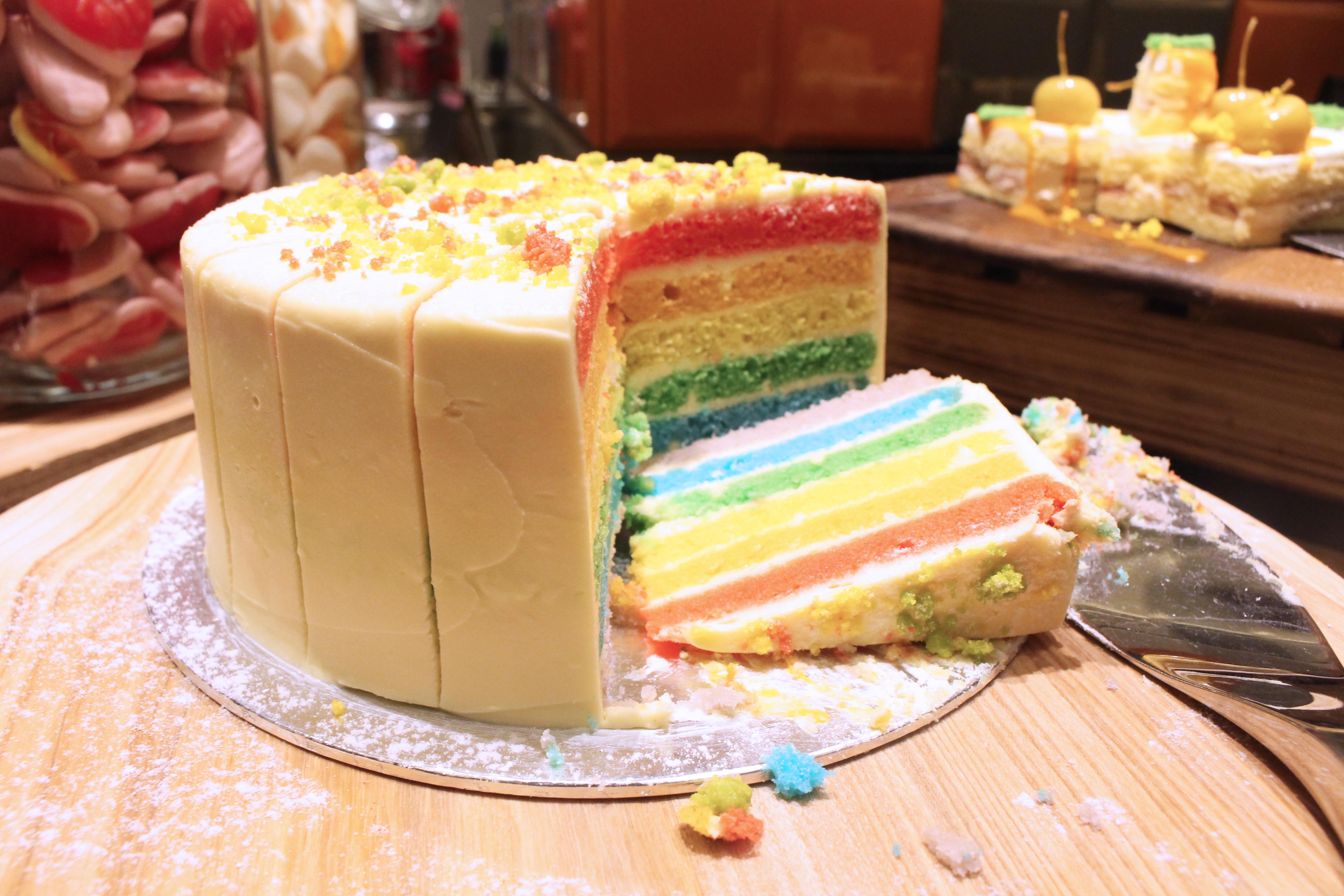 Rainbow cake being seen here, amongst the numerous dessert offerings of cakes like strawberry short cake, tiramisu, jelly treats and more.