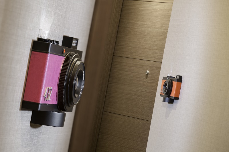 The Dorsett's modern design incorporates some fun artsy touches, such as the quirky cameras that serve as doorbells on the guest room doors.